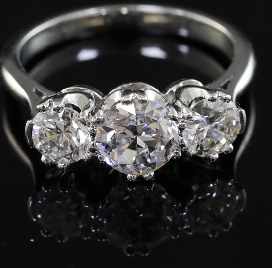 A white gold? and three stone diamond ring, size L/M.